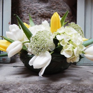 green planter with flowers